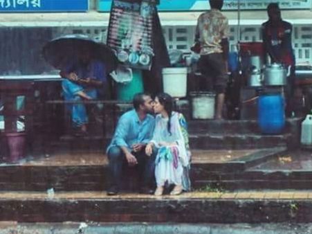 Photographer sacked after kiss photo goes viral