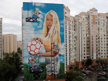 Russian art director displays wife’s giant public mural in Moscow for World Cup