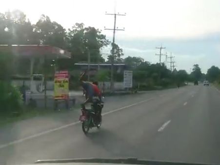 This man is flying on his motorcycle; never try this