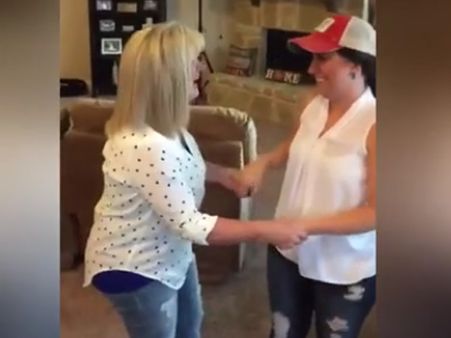 This mother shrieks in excitement while sorting out old clothes. Why?