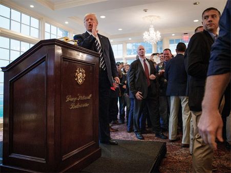 Defying analysts, Team Trump predicts economic boom