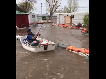 This man is having a gala time during floods