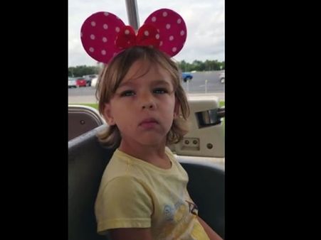 This little girl suddenly discovers that she is entering Disney World; her reaction is priceless