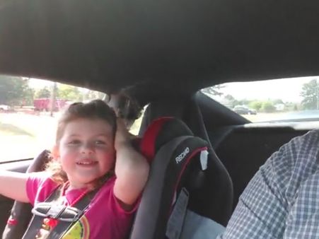 This 4-year-old girl has a craving for speed & she asks her dad to drive even faster!