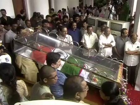 With his trademark glasses, Karunanidhi lies in state with his first child Murasoli