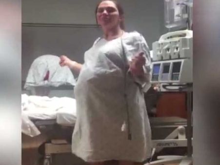 Pregnant woman is doing something unique in hospital