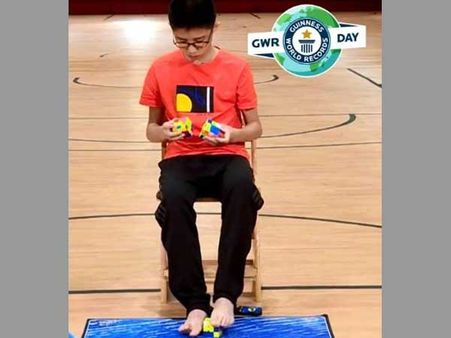 Chinese teenager solves three Rubik’s cubes with hands and feet at same time