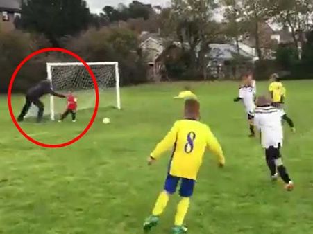 Funny video: Dad pushes distracted little goalkeeper son over to save goal