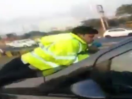 Gurgaon: Man drags traffic cop on bonnet after refusing to stop