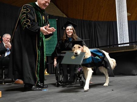 US: Dog awarded with honorary diploma for helping challenged woman graduate
