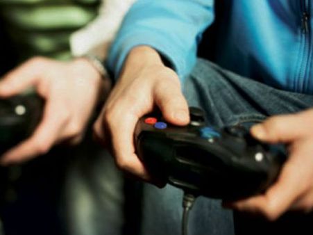 This teen is so addicted to video games that his mother hand-feeds him as he goes on playing