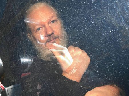 Hillary Clinton says Julian Assange must 'answer for what he has done'