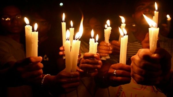 Youth Congress takes out candle march, woman protests outside Parliament over crime against women