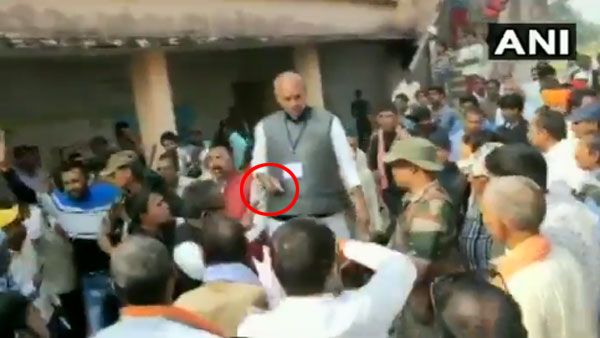 On camera, Congress candidate brandishes pistol outside polling booth in Jharkhand