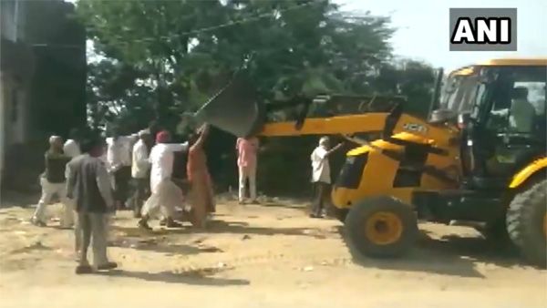 WATCH: Woman sarpanch of Rajasthan climbs JCB to stop anti-encroachment drive
