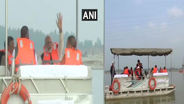PM Modi rides boat in Ganga at Atal ghat, reviews Namami Gange project