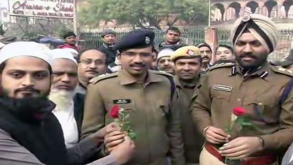 Want peace: Locals in Delhi's Jama Masjid area offer roses to police amid anti-CAA protests