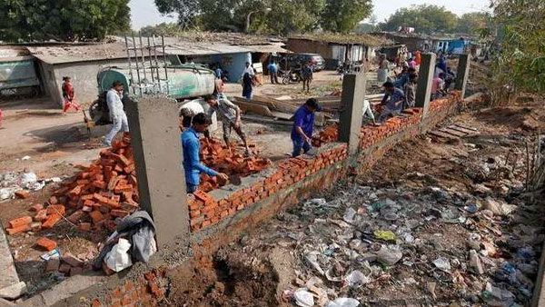 Trump visit: AMC building wall to mask slum area says Congress