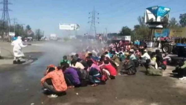 Furore after migrants sanitised with chemical spray in Bareilly