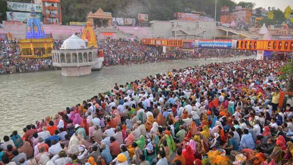 Kumbh Mela: Thousands of devotees flout COVID-19 norms, take holy dip in Ganga on Shahi Snan as virus surges
