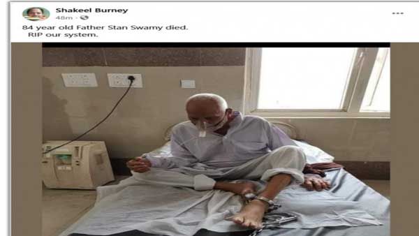 Fake: The old man in this image with his feet chained is not Stan Swamy