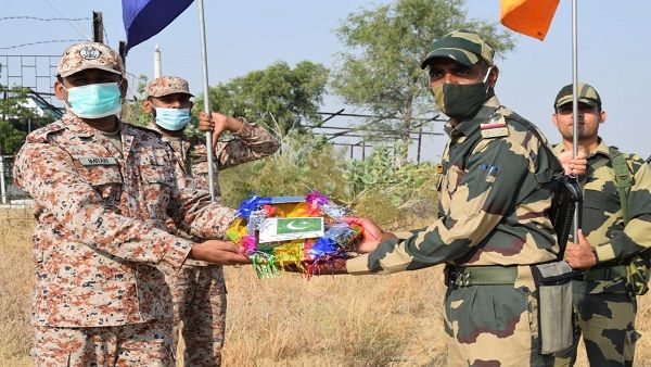 India, Pakistan border troops exchange sweets on Independence Day