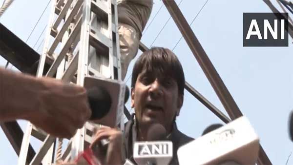 Denied ticket, former AAP councillor climbs transmission tower | Video
