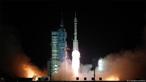 China launches astronauts to complete space station work