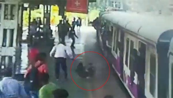 Seconds before being hit by a train, mother and child saved by RPF jawans | VIDEO