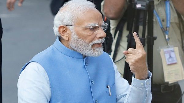 PM Modi stands in queue, casts his vote in Ahmedabad
