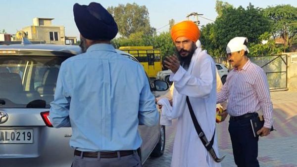 Why has Amritpal been booked under the stringent NSA