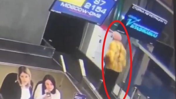 Watch: Elderly Woman In Russia Mistakenly Rides Conveyor Belt Into Luggage System!