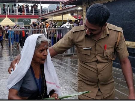 ഭക്തരെ സഹായിക്കുന്ന പോലീസ്.. ചിത്രം കണ്ട് കുരുപൊട്ടിയവര്‍ക്ക് മറുപടിയുമായി പോലീസുകാരന്‍