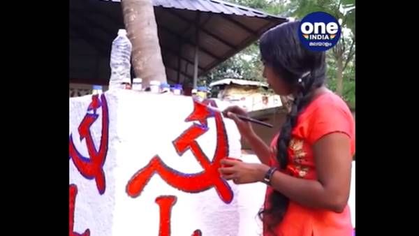 തദ്ദേശ തിരഞ്ഞെടുപ്പ്; തൃശ്ശൂരില്‍ സ്ഥാനാര്‍ത്ഥിക്കായി ചുവരെഴുതുന്നത് ചിത്രകലാ വിദ്യാര്‍ത്ഥിനി