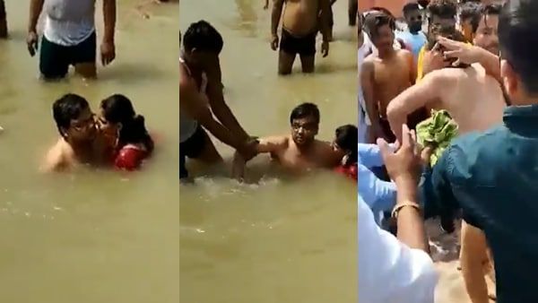 നദിയില്‍ കുളിക്കുന്നതിനിടെ ഭാര്യയെ ചുംബിച്ചു; വളഞ്ഞിട്ട് മര്‍ദ്ദിച്ച് ജനക്കൂട്ടം, വീഡിയോ പുറത്ത്