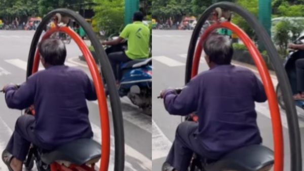 ടയറിനുള്ളിൽ കയറിയിരുന്ന് മോട്ടോർ സൈക്കിളോടിച്ച് വൃദ്ധൻ, ടൈം ട്രാവലറെന്ന് സോഷ്യൽ മീഡിയ !
