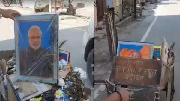 ଅଳିଆ ଗାଡିରେ ମିଳିଲା ମୋଦି ଓ ଯୋଗୀଙ୍କ ଫଟୋ,କର୍ମଚାରୀ ସସପେଣ୍ଡ