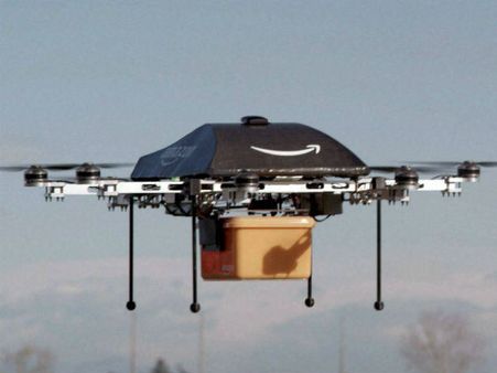 ஆளில்லா விமானத்தை பயன்படுத்தி பொருட்களை டோர் டெலிவரி செய்ய அமேசான் திட்டம்! அடுத்த மாதம் அறிமுகம்!!