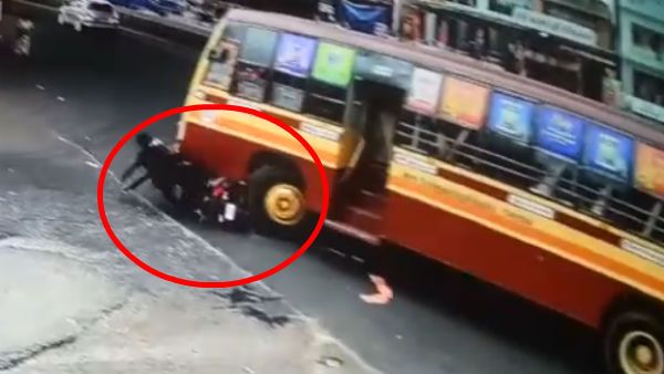 பஸ் சக்கரத்தின் அடியில் சிக்கிய 2 பேர் தலைகள்.. பதற வைக்கும் வீடியோ.. நல்லவேளை.. உயிர்காத்த ஹெல்மெட்