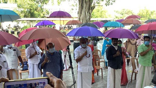 முன்மாதிரி கிராமமாக திகழும் தண்ணீர்முக்கோம்... வண்ண வண்ண குடைகளுடன் உலா வரும் மக்கள்