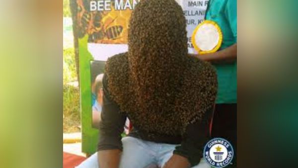 4 மணி நேரம்... 60000 தேனீக்கள்.. வித்தியாசமான கின்னஸ் சாதனை படைத்த கேரள இளைஞர்!