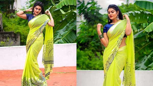 புடவையைத் தூக்கிப் பிடித்து.. கேட்டுக்கு அருகில் நின்று.. கலக்கறீங்களே நிவிஷா