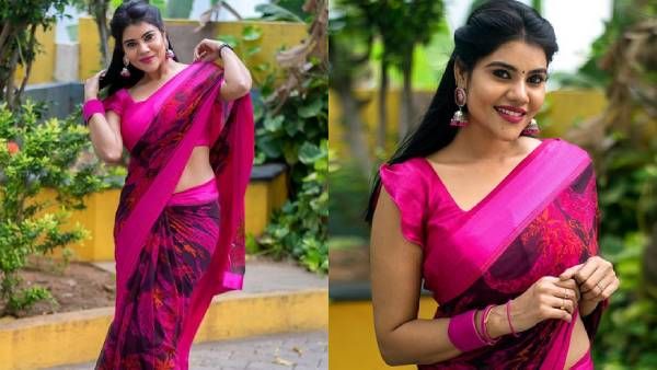 பஞ்சு மிட்டாய் சேலை கட்டி.. பளபளக்கும் இடுப்பை காட்டி.. கலக்கும் நிவிஷா!