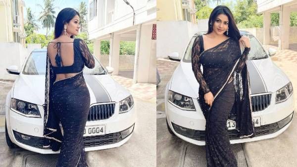 காரைப் பார்க்கிறதா.. இல்லை.. யாரைப் பார்க்கிறது.. மயக்க வைக்கும் லிசா!