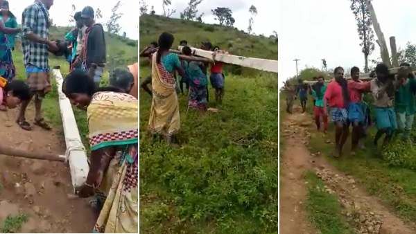 மின்சாரம் இன்றி தவிப்பு... சாலை வசதியில்லாததால் மின் கம்பத்தை தோளில் சுமந்து சென்ற பழங்குடிகள்