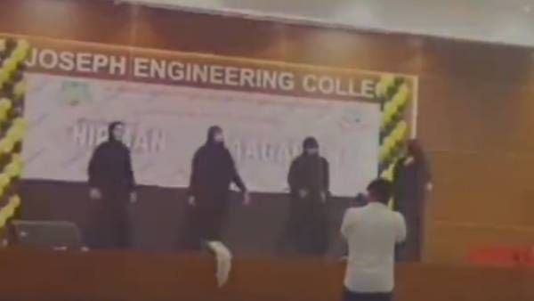 புர்கா அணிந்து கொண்டு 