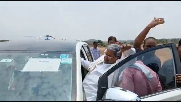 காரில் இருந்து திடீரென கீழே விழுந்த சித்தராமையா.. தொங்கியபடி கையசைத்ததால் சம்பவம்.. ஷாக் வீடியோ