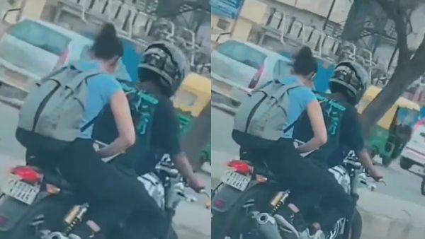 கடமை உணர்ச்சிக்கு அளவே இல்லையா.. பைக்கில் செல்லும் போதுகூட லேப்டாப்பில் வேலை பார்த்த இளம்பெண்