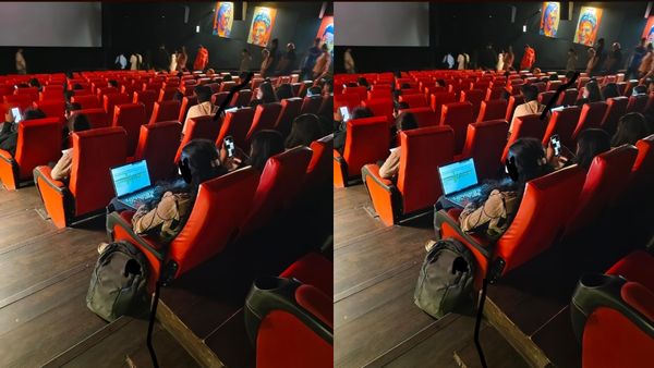 தியேட்டரில் தெரிந்த வெளிச்சம்.. லேப்டாப்பை திறந்து பணி செய்த பெண்.. Work From Home-ன் பரிதாப நிலை