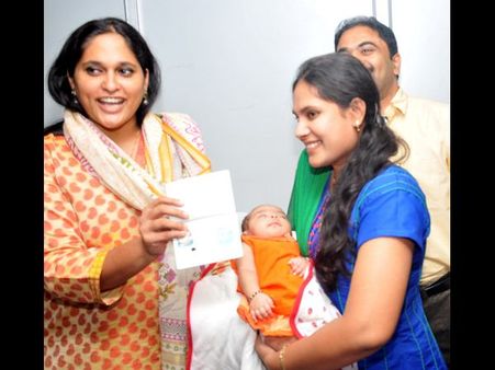 రెండు నెలల పాపకు రెండు కోట్లవ పాస్‌పోర్ట్ (పిక్చర్స్)